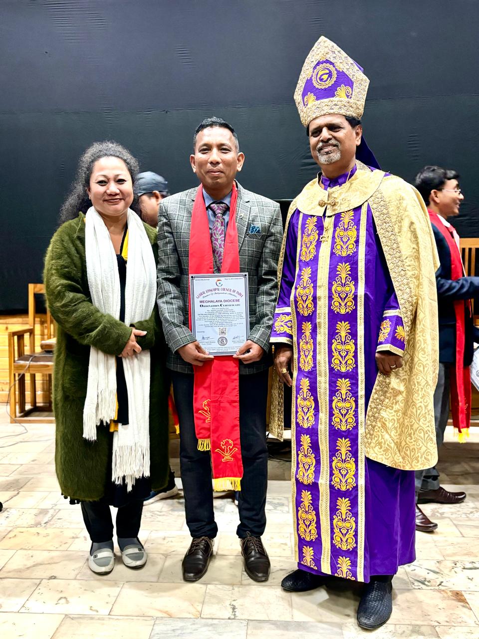 Posing with a certificate from Meghalaya Diocese.