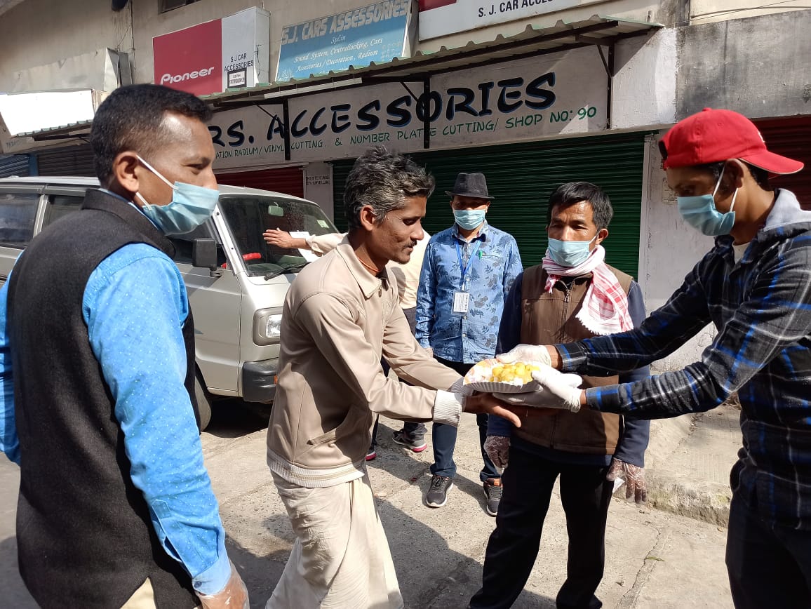 Handing out food on the street.