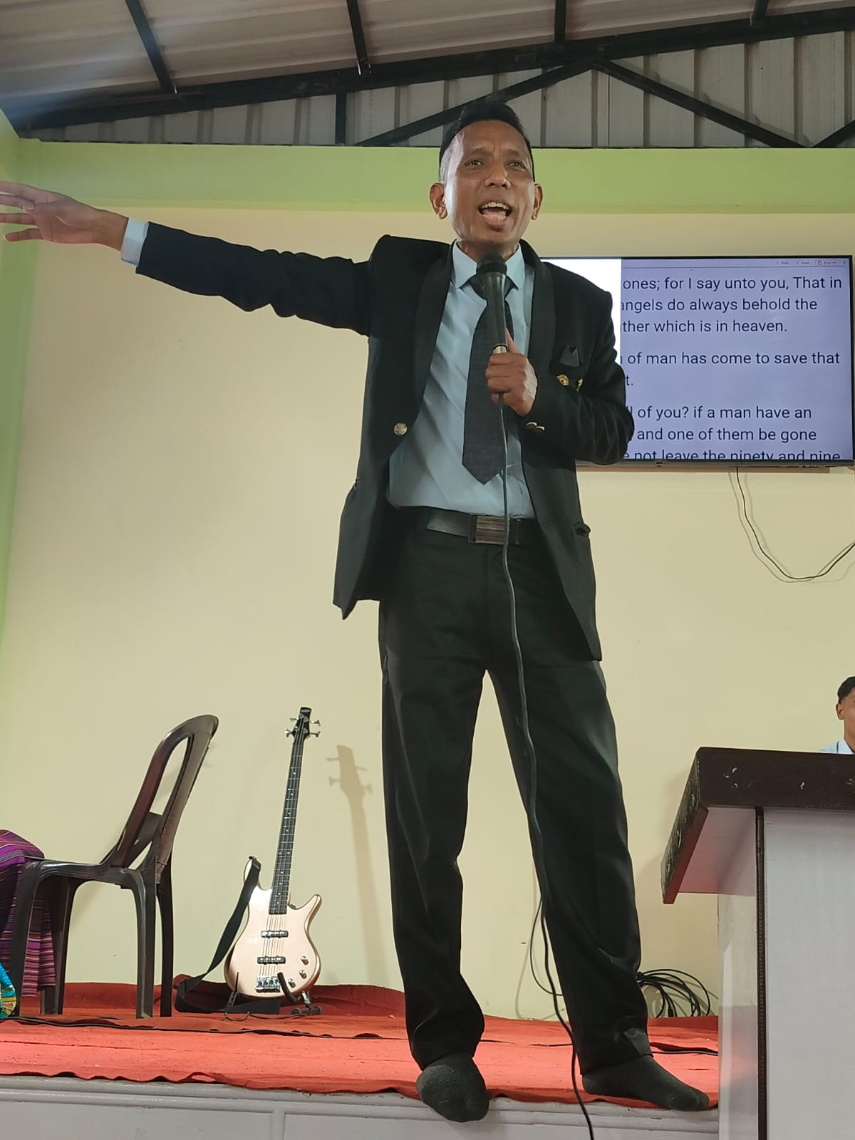 Speaking passionately from a stage.