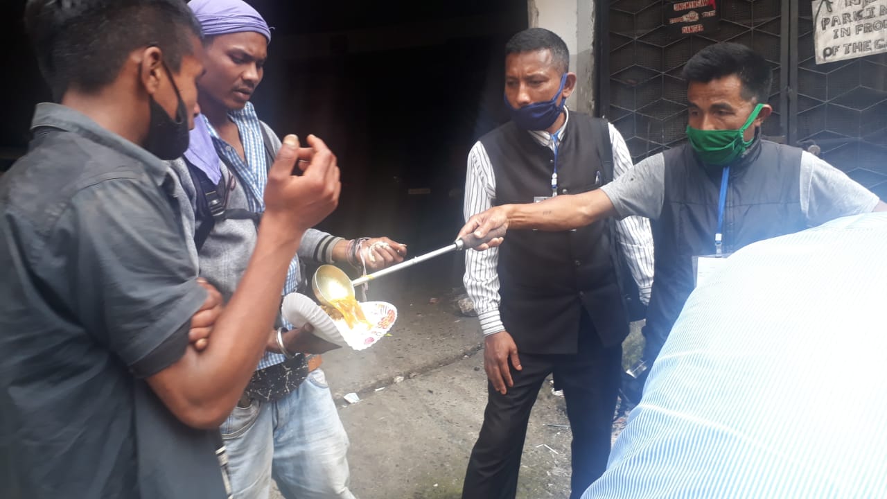 Serving hot food to people on the street.